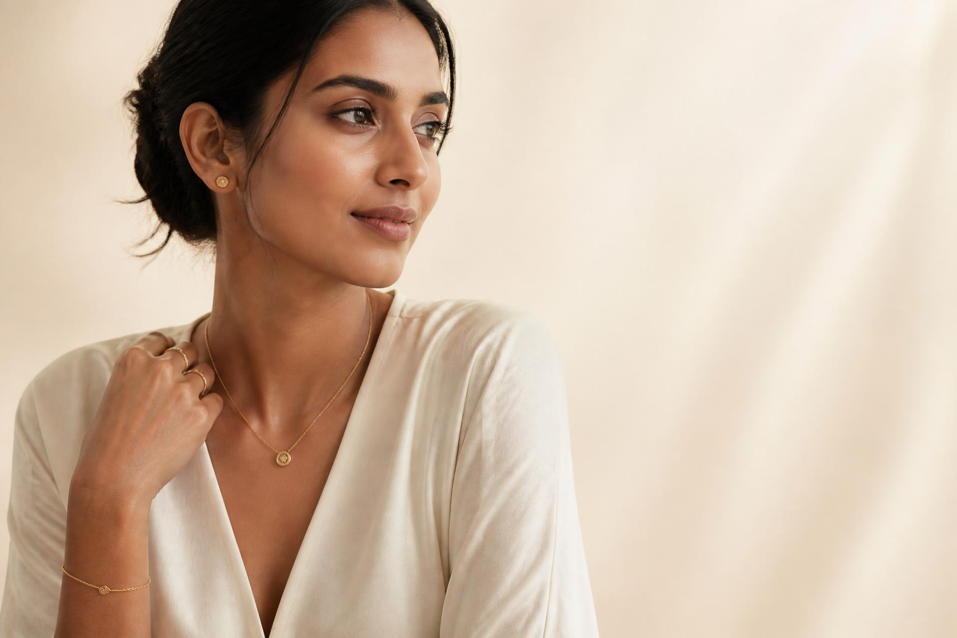 Elegant woman wearing delicate gold jewellery by Ékszeria