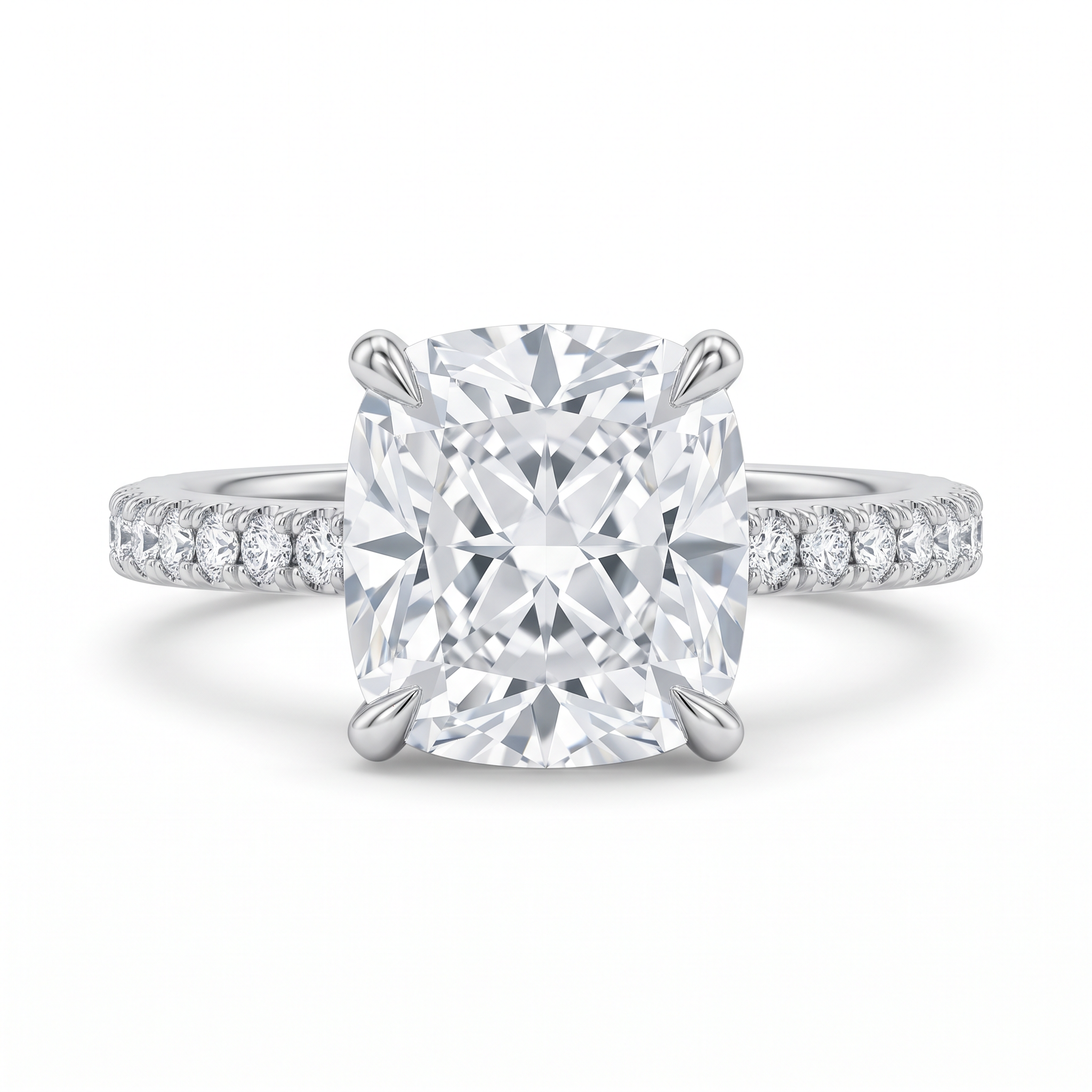 Cushion-cut diamond solitaire ring on a white gold pavé band